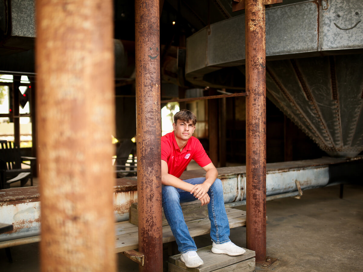 Riley Revere in his red Katy polo under the old silo