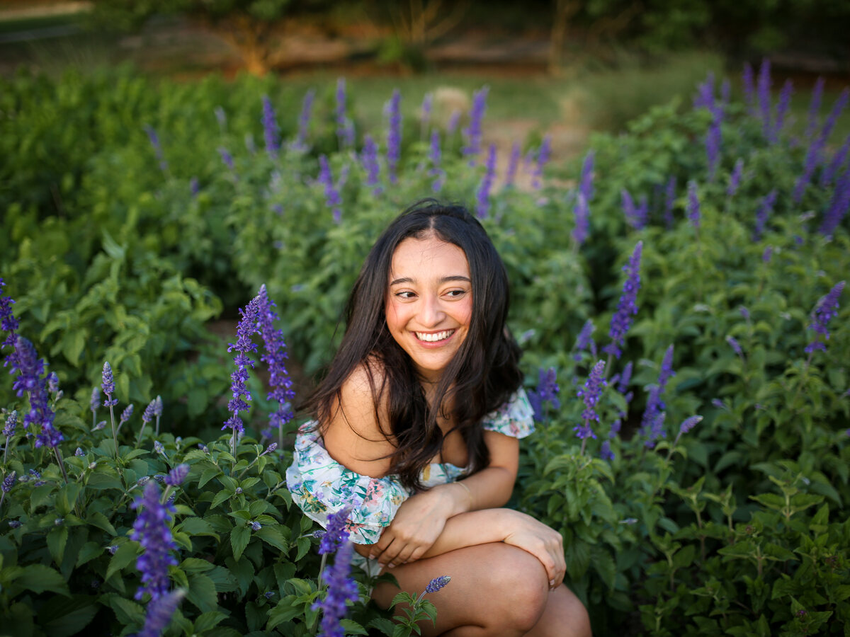 Giselle laughing among purple salvia blooms